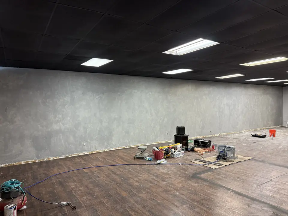 Before: barbershop floor with backlit mirrors