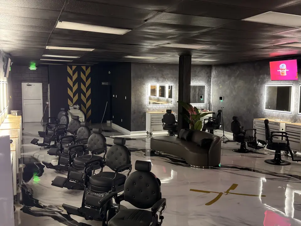 Finished barbershop with stations, mirrors and lounge seating