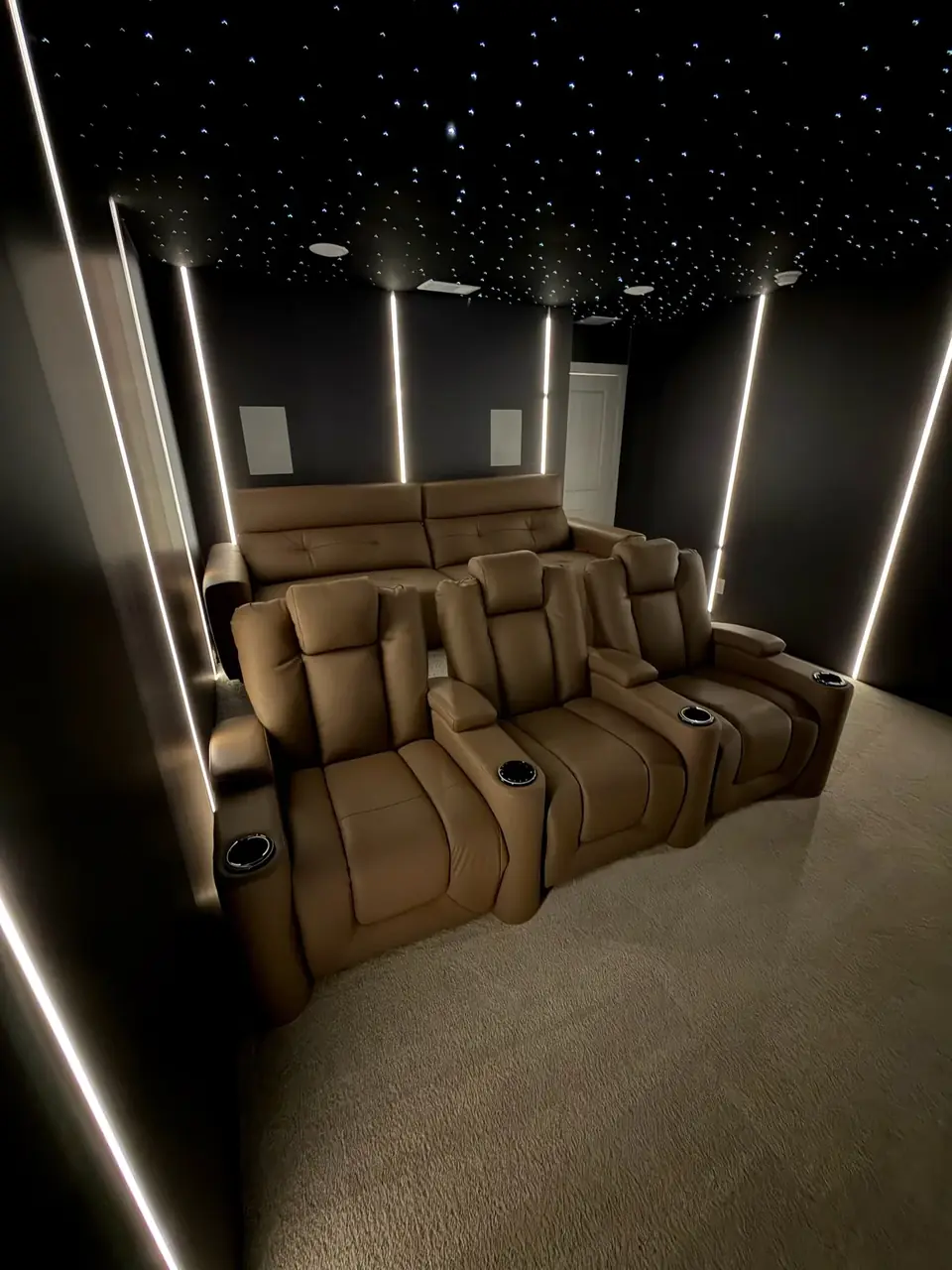 Media room with starlight ceiling and leather recliners