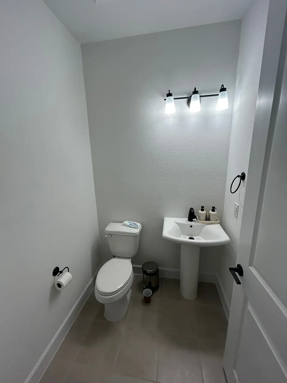 Before: builder-grade powder room with pedestal sink